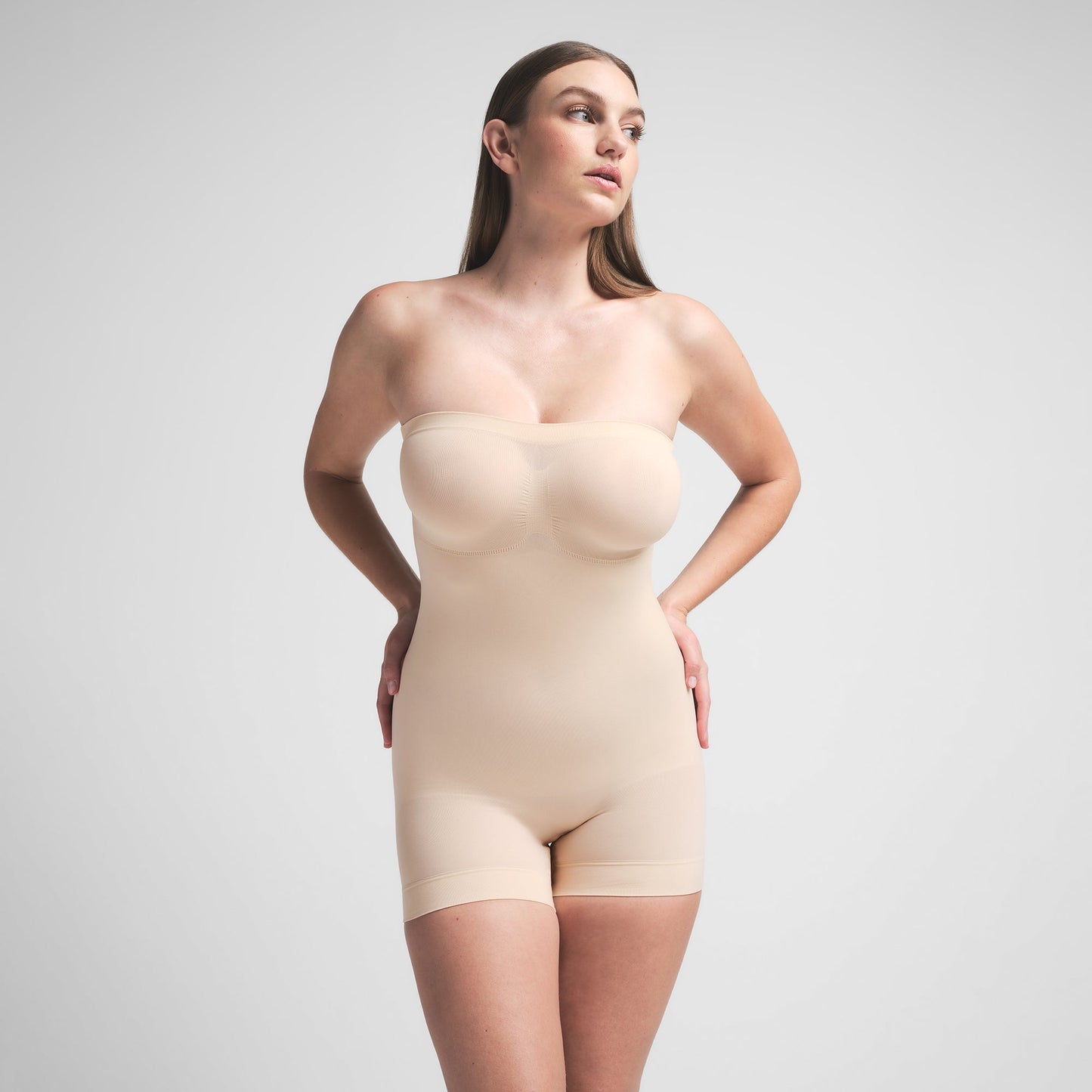 SEAMLESS SCULPT STRAPLESS SHORTIE BODYSUIT | SAND