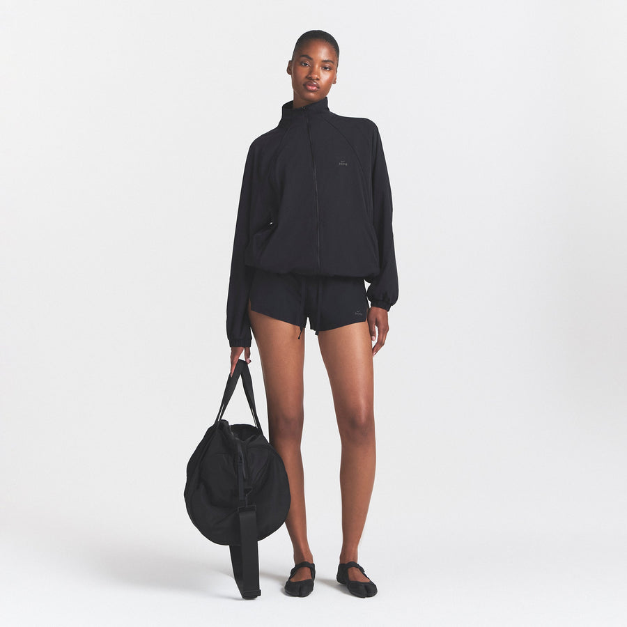 NikeSKIMS STRETCH NYLON OVERSIZED TRACK JACKET | OBSIDIAN