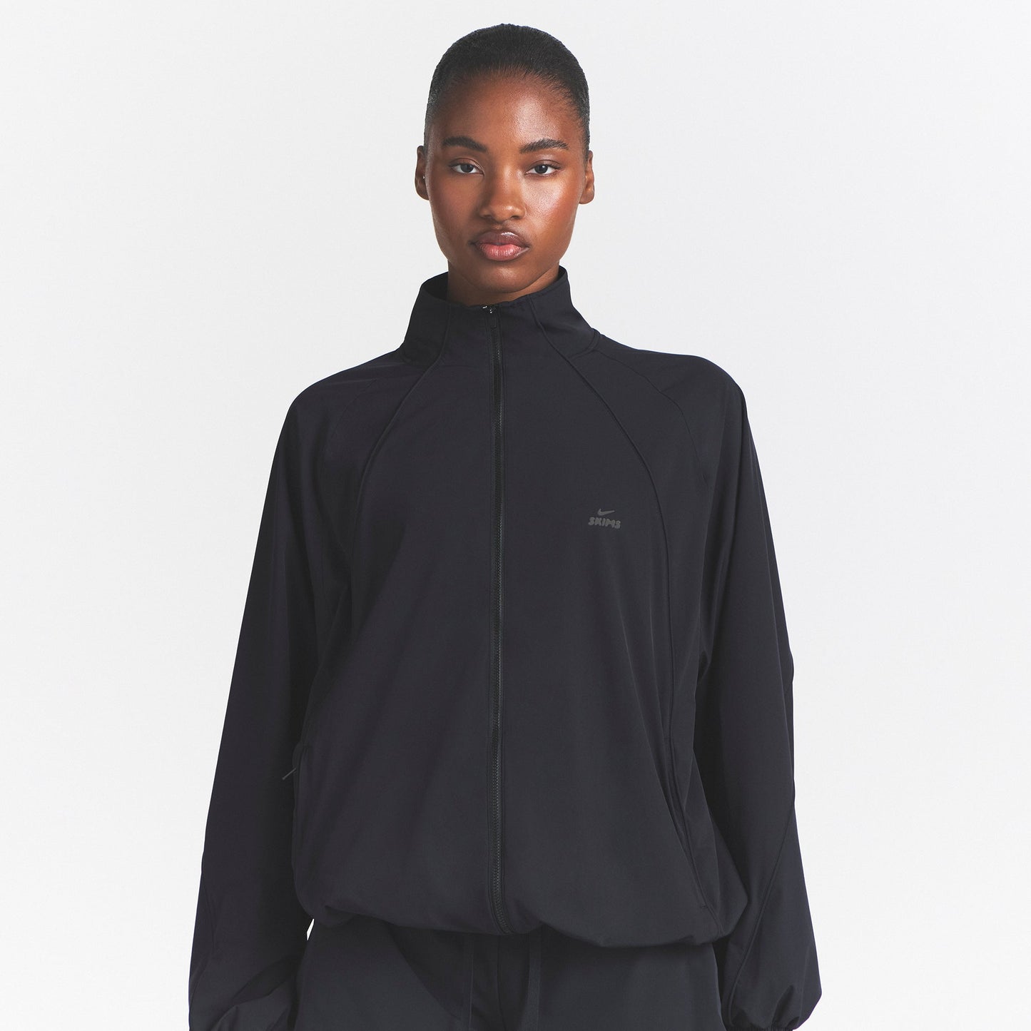 NikeSKIMS STRETCH NYLON OVERSIZED TRACK JACKET | OBSIDIAN