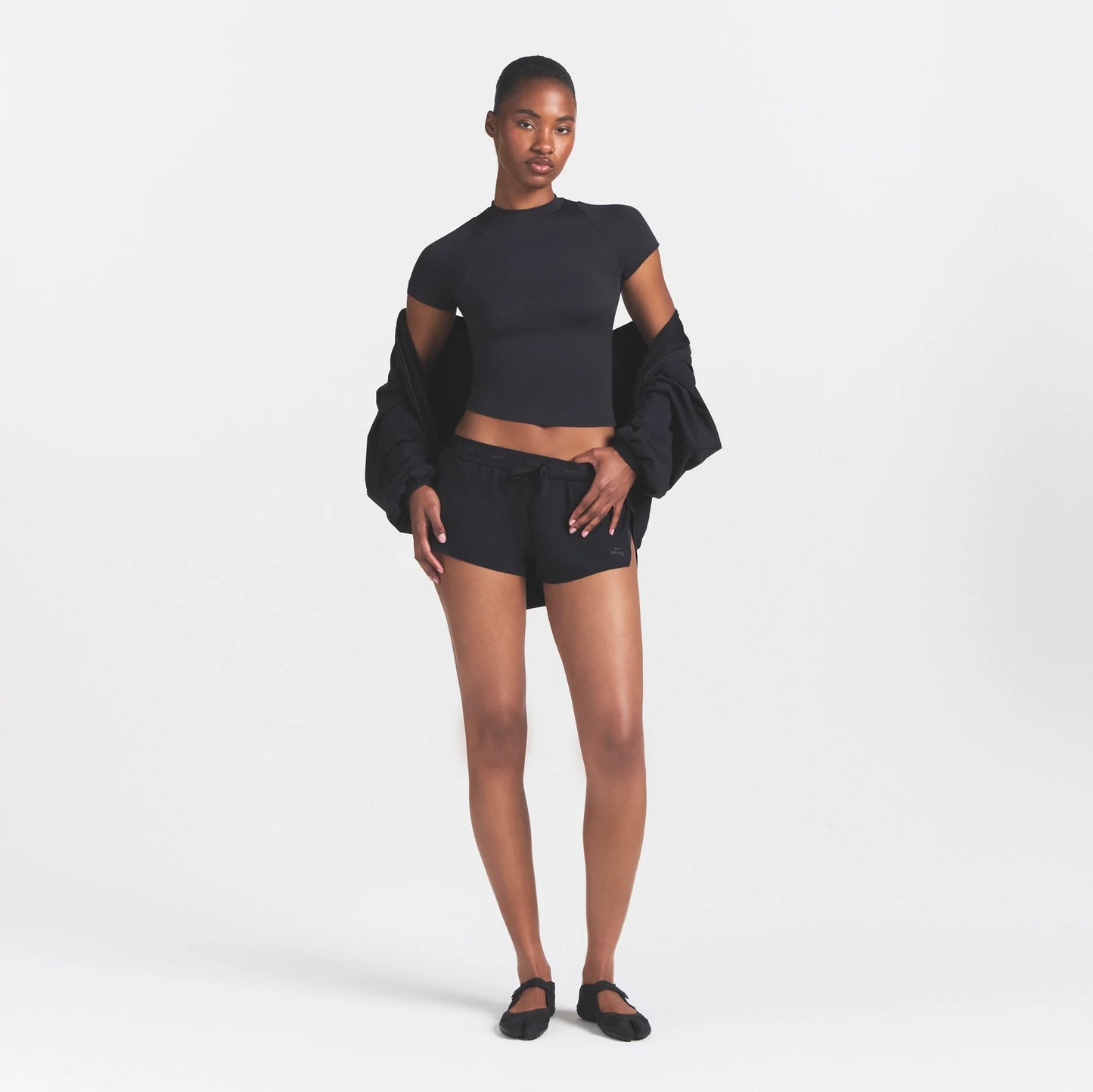 NikeSKIMS STRETCH NYLON RUNNER SHORT | OBSIDIAN