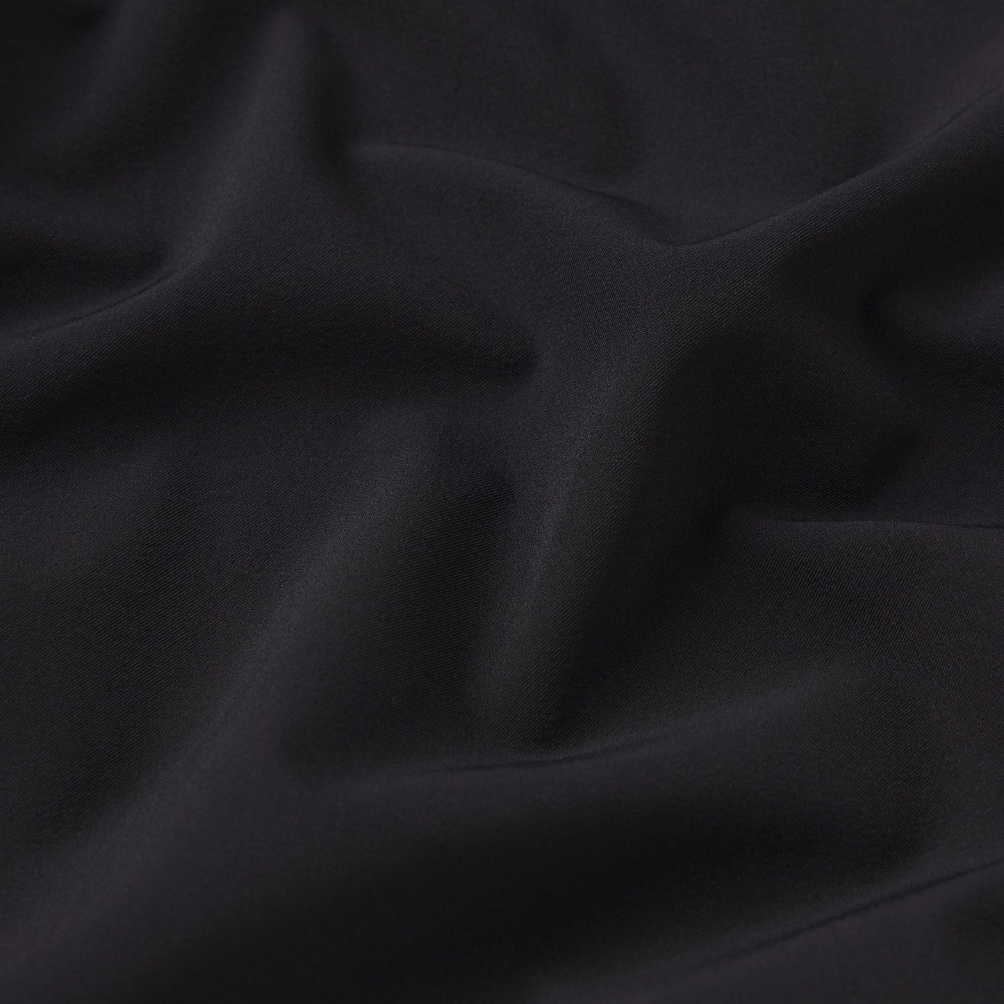 NikeSKIMS STRETCH NYLON RUNNER SHORT | OBSIDIAN