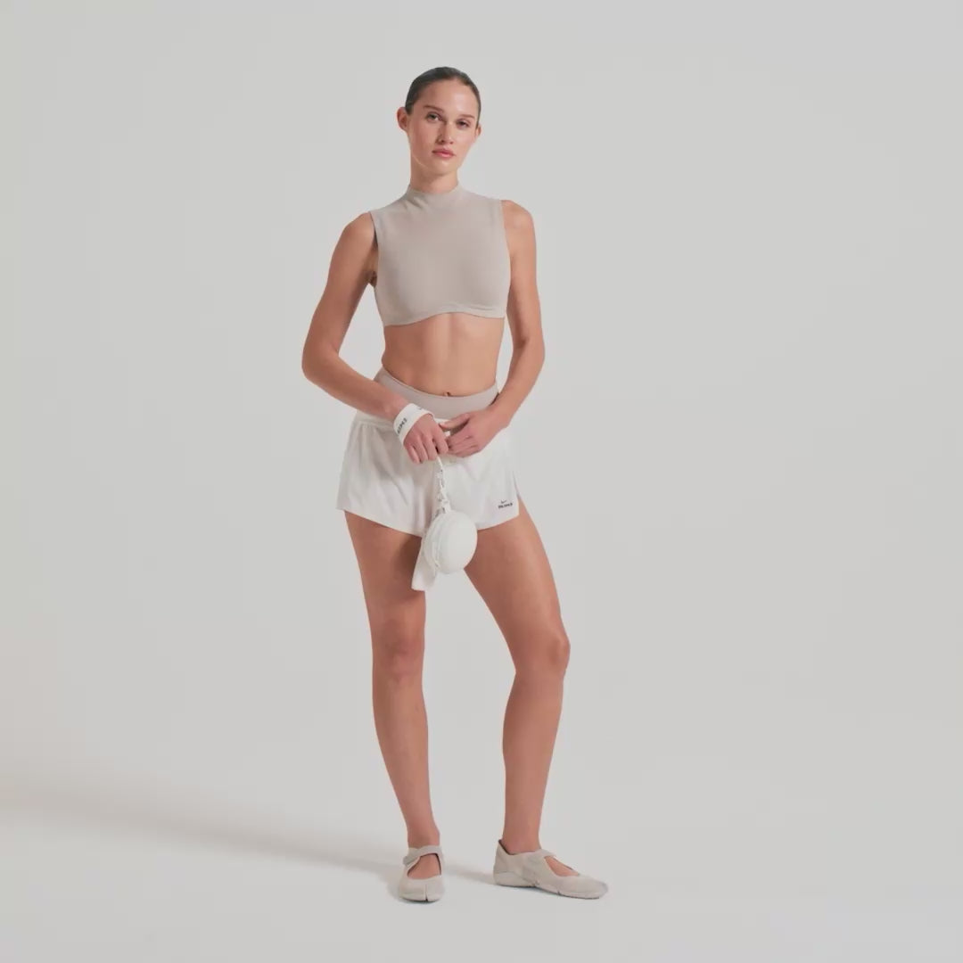 NikeSKIMS STRETCH NYLON RUNNER SHORT | IVORY